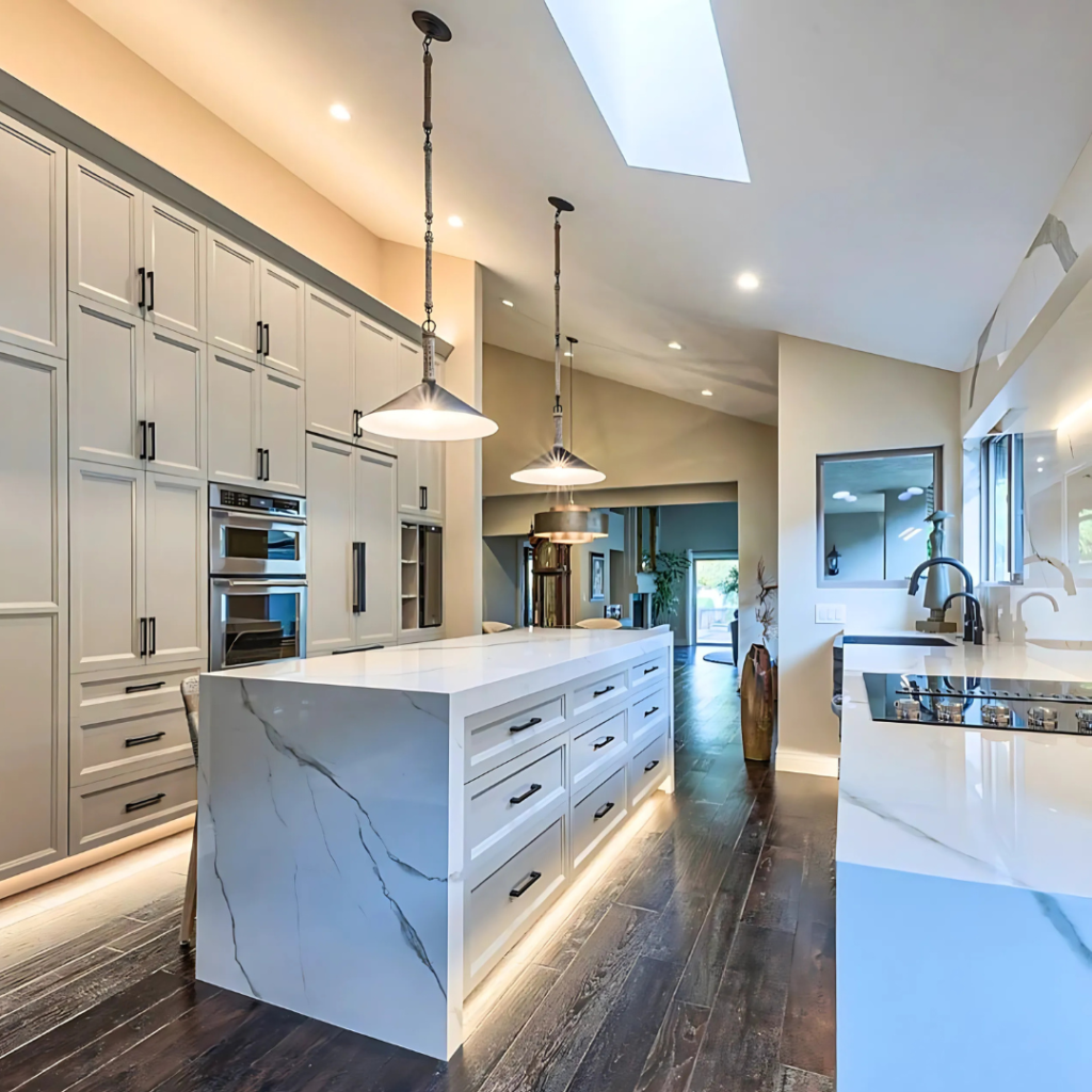 Modern kitchen design by Kasavan Construction in Corral de Tierra, featuring sleek cabinets, ambient floor lighting, and a contemporary aesthetic.